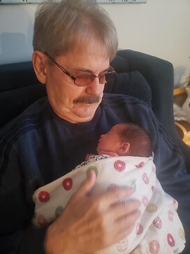 That is me with my second grandbaby...what a lively on now.