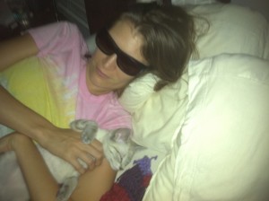 The Migraine Girl wears sunglasses at night.