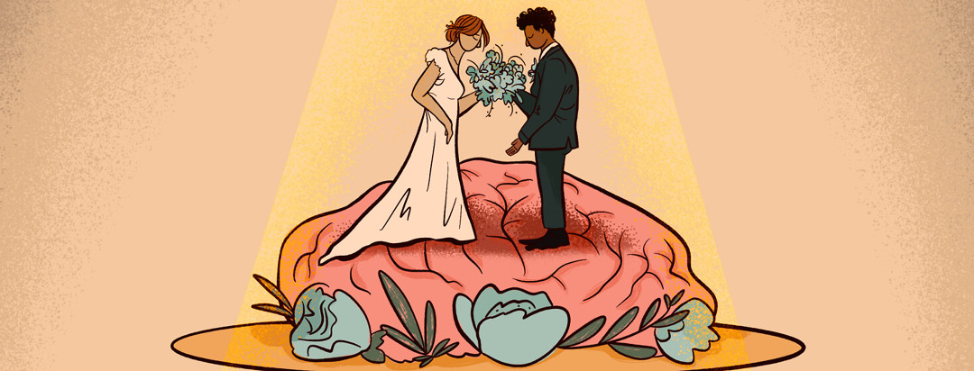 Spotlight on married couple cake topper staring down at brain on platter