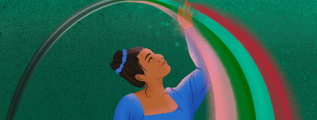 Filipino woman with hair tied in bun lifts hand to touch rainbow that faded from black and white behind her to full color before her.