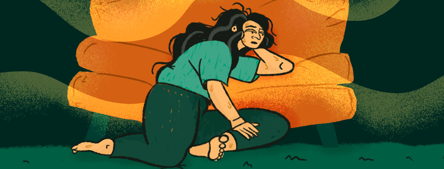 Woman with gray hairs lay fatigue and sweating on couch as humid waves blast on by