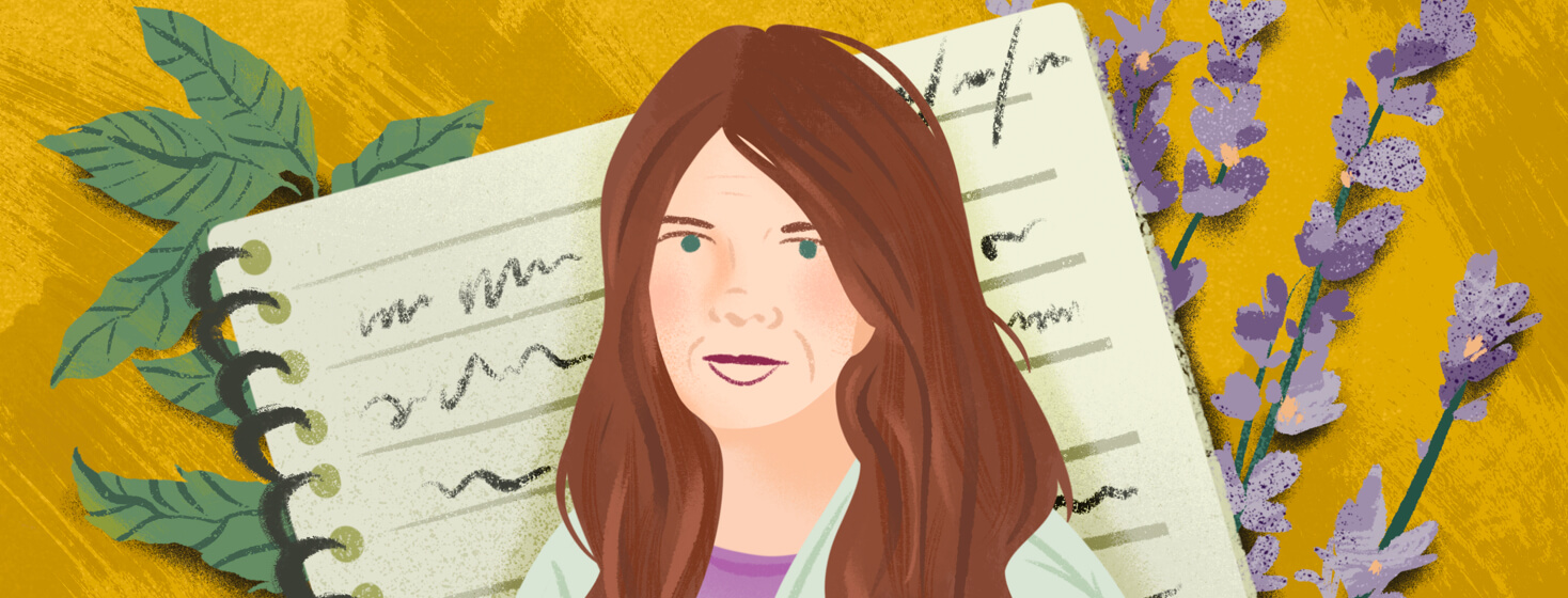 Dr Sara Crystal with migraine diary and sprigs of peppermint leaves and lavender flowers