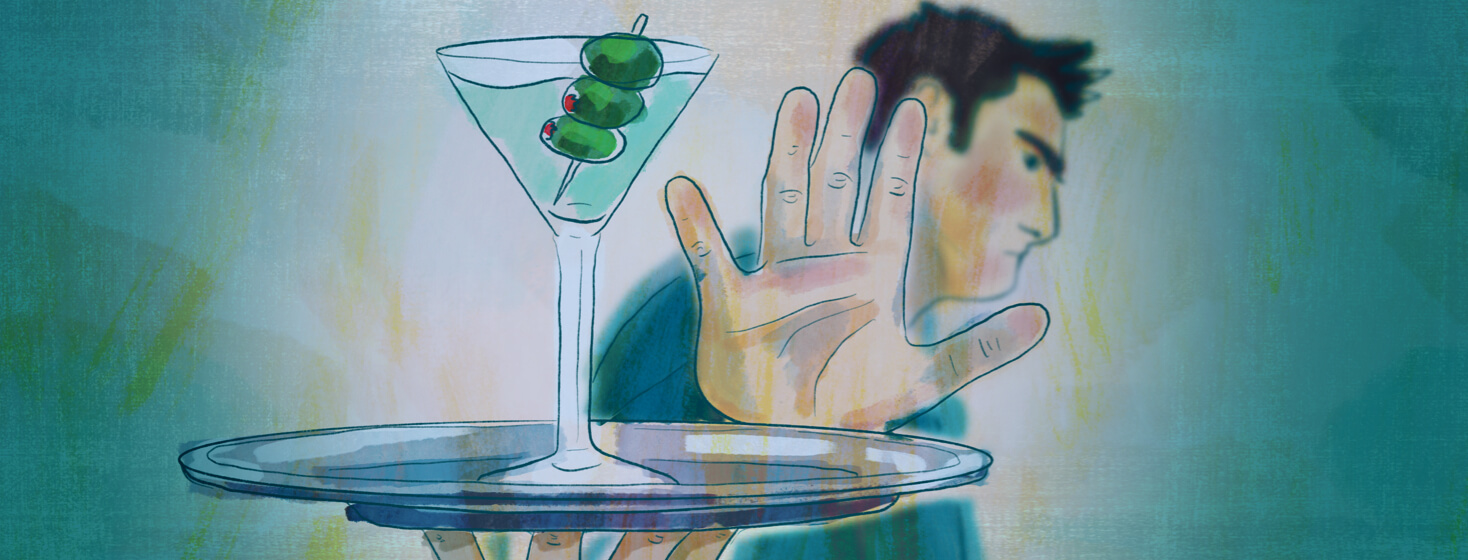 Man waves away a plate with a martini on it